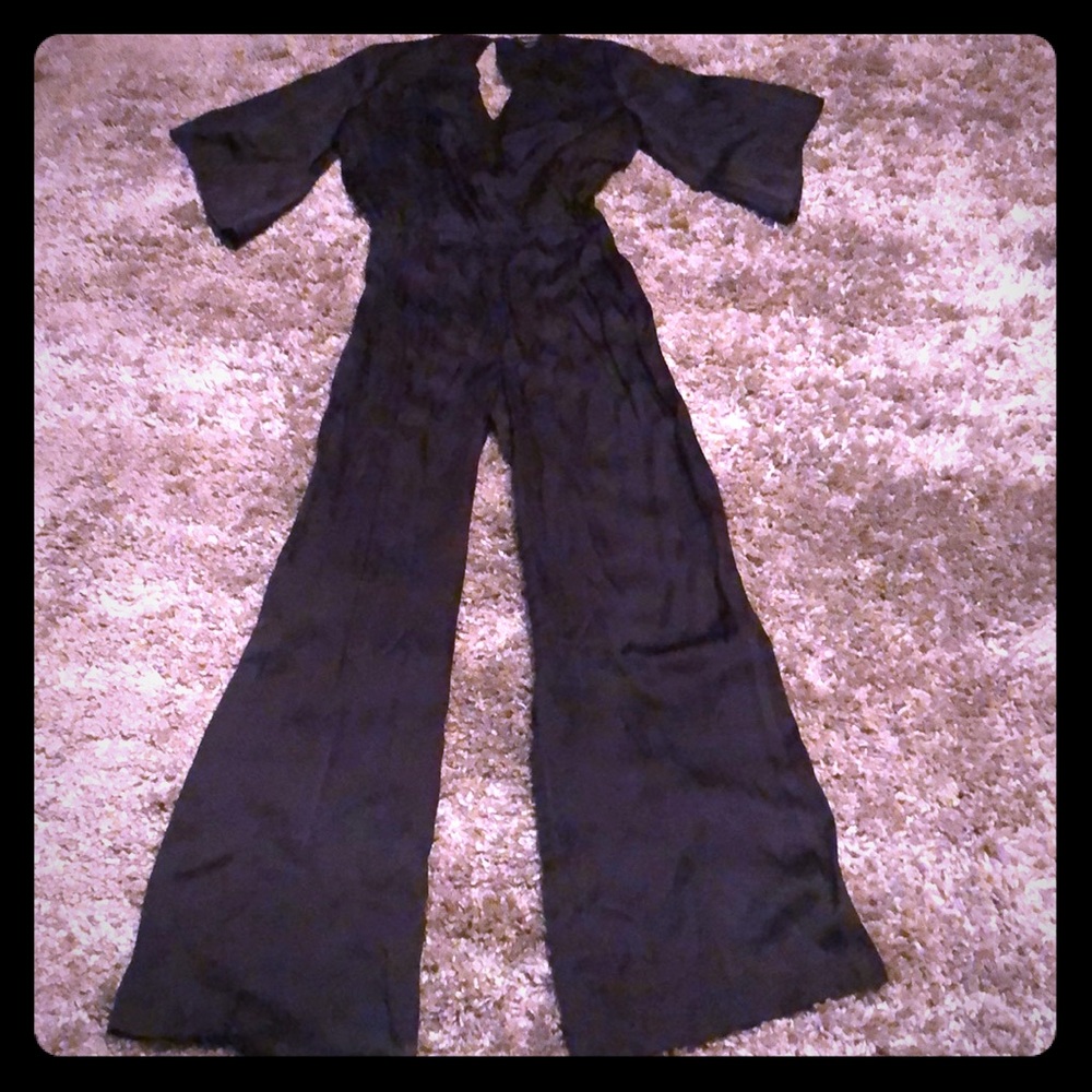 Bebe women’s black jumpsuit size S preowned